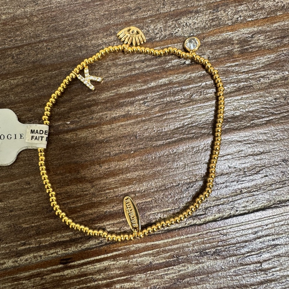 Gold Beaded anthropology Bracelet with Charms